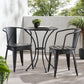 A black 3-piece patio bistro set, consisting of two chairs and a round table, is placed on a patio with a pool and greenery in the background, KOSSMAI